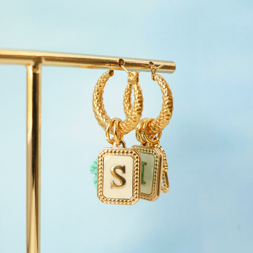 Maak een unieke collectie met roestvrij stalen schelp bedels met letters